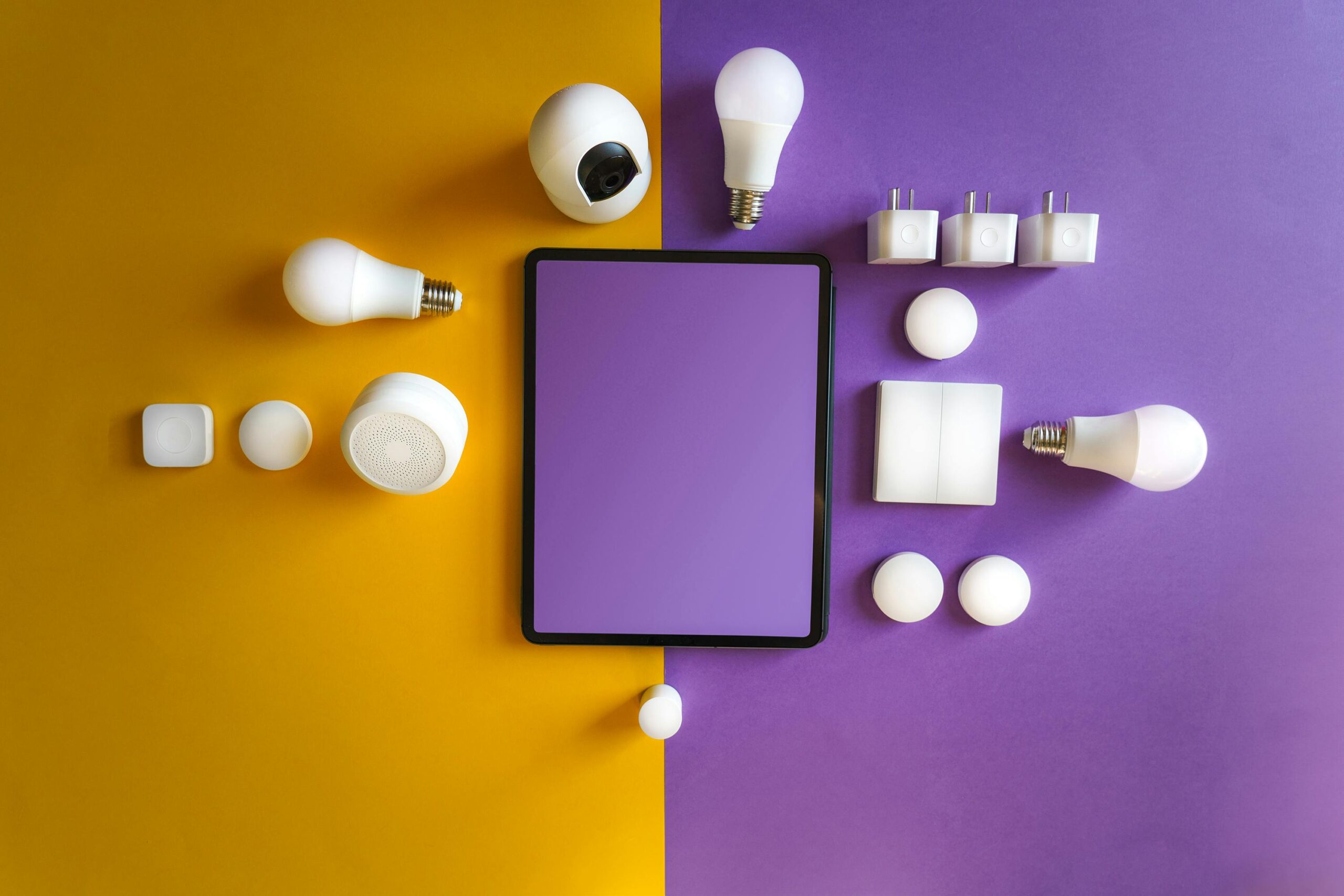 Services Innovative smart home gadgets arranged in a modern flat lay.